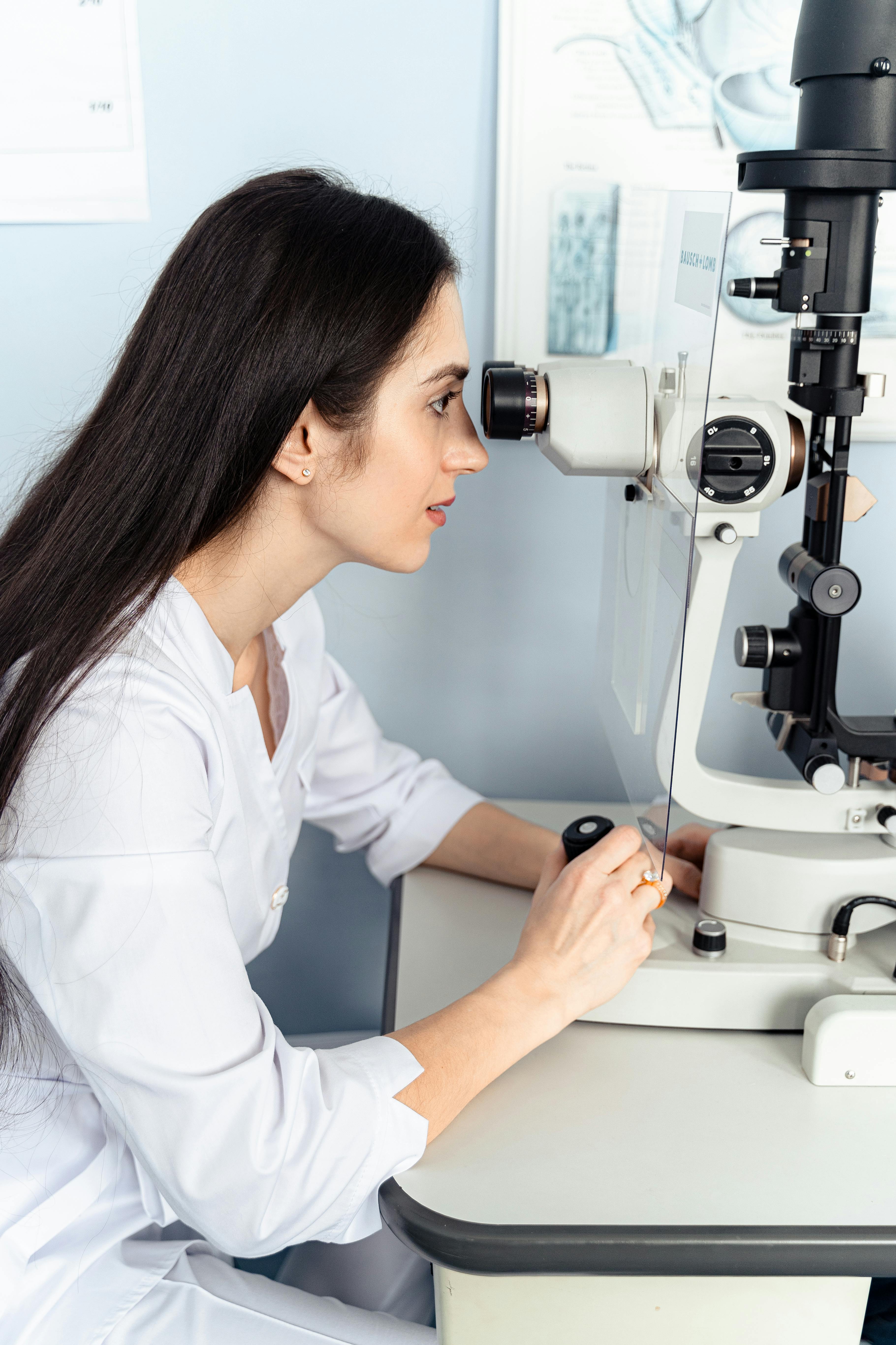Ophthalmologist at a slit lamp examining a patient — standard diagnostic workup for glaucoma